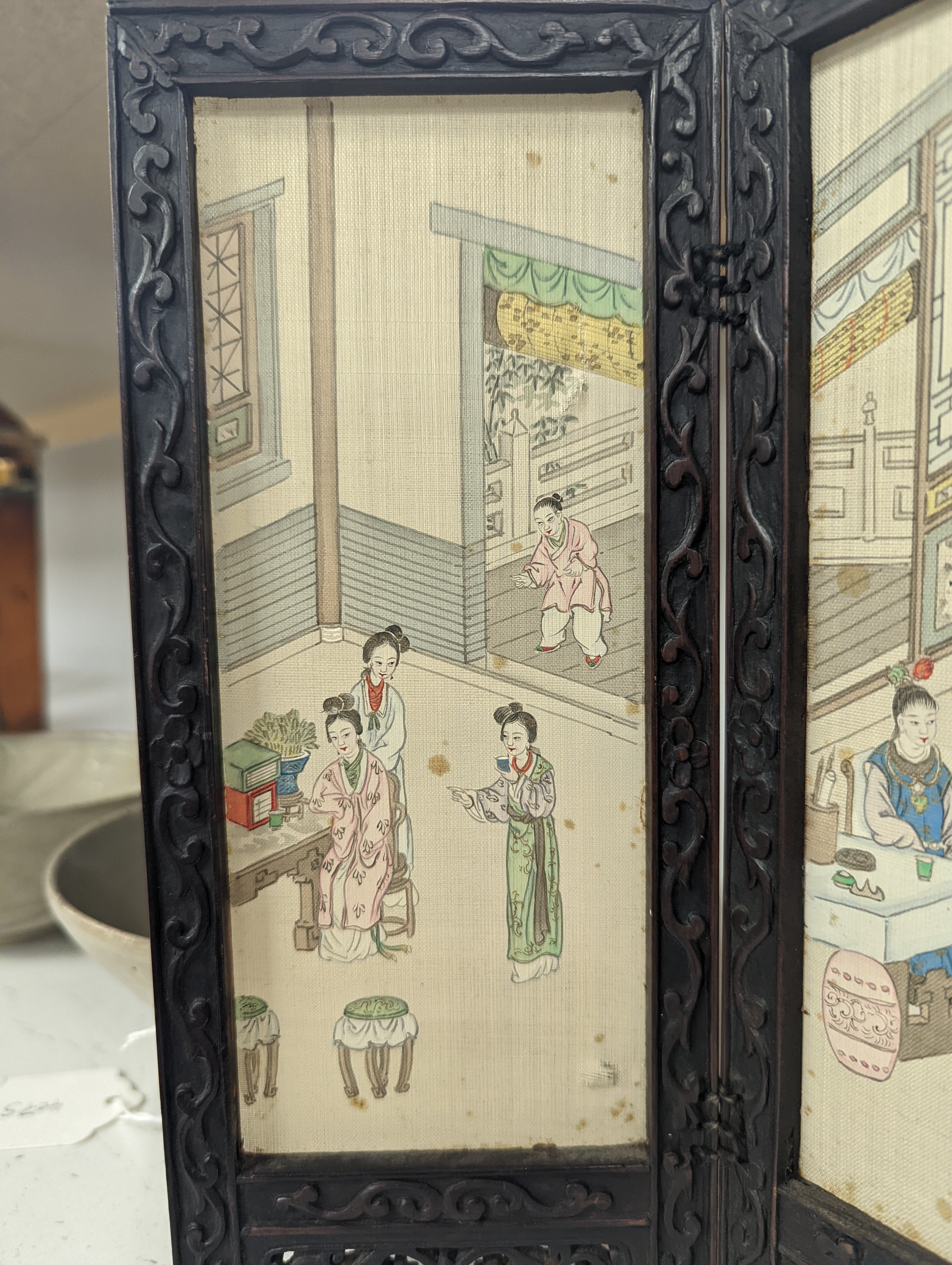A Chinese hardwood framed painted silk four fold miniature screen, inset with painted silk panels, 28cm